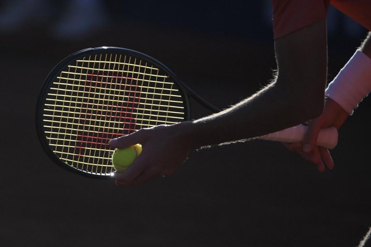 Greece's Stefanos Tsitsipas holds the ball as he prepares to serve to Argentina's Facundo Diaz Acosta during the ATP Barcelona Open "Conde de Godo" tennis tournament singles match at the Real Club de Tenis in Barcelona, on April 19, 2024.  Josep LAGO / AFP