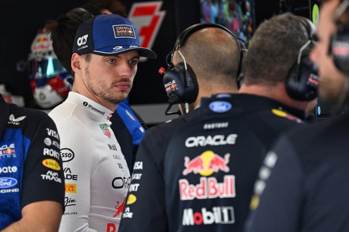 Red Bull Racing's Dutch driver Max Verstappen (L) is pictured in the garage before the qualifying session ahead of the Formula One British Grand Prix at the Silverstone motor racing circuit in Silverstone, central England, on July 4, 2026.  PETER POWELL / POOL / AFP