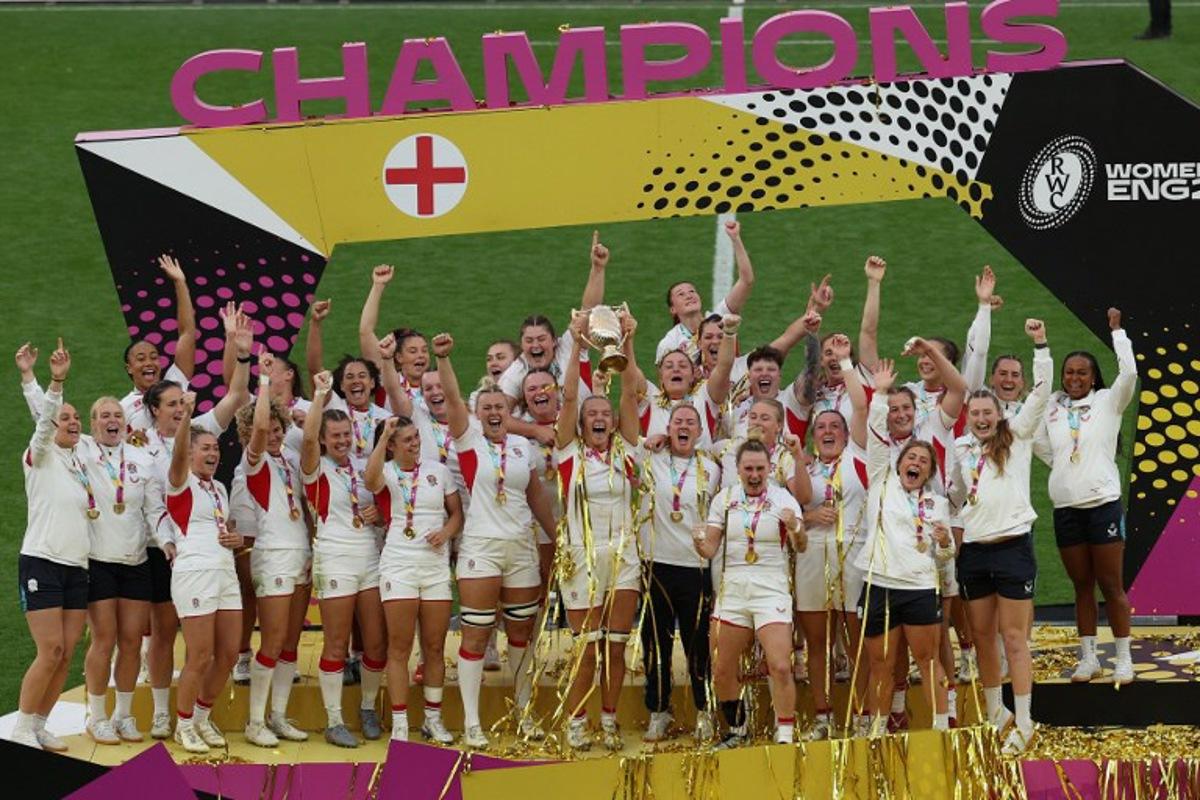 England lift the trophy after winning the Women's Rugby World Cup final between Canada and England at The Allianz Stadium, Twickenham, south-west London on September 27, 2025.  England beat Canada 33-13. Adrian Dennis / AFP