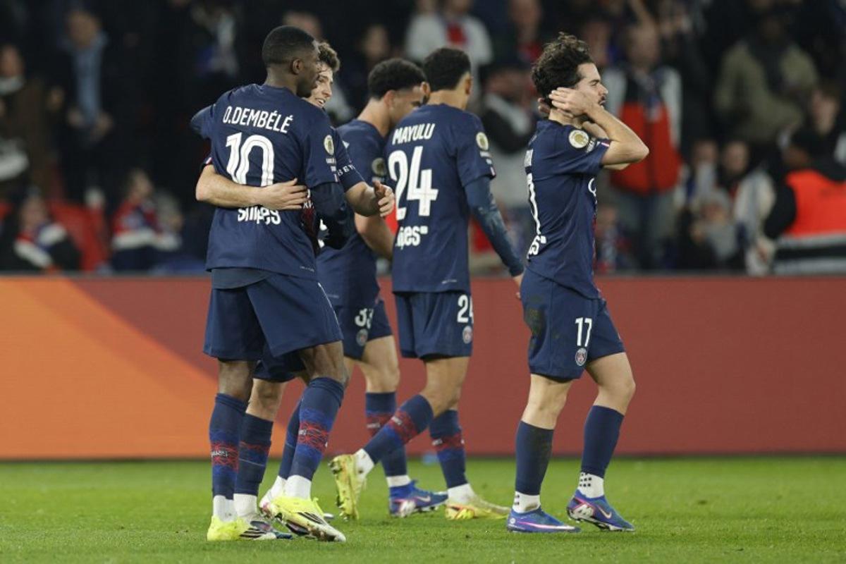 Paris Saint-Germain's French forward #10 Ousmane Dembele (L) celebrates with Paris Saint-Germain's Portuguese midfielder #87 Joao Neves (2L) after scoring Paris Saint-Germain's second goal during the French L1 football match between Paris Saint-Germain (PSG) and Olympique de Marseille (OM) at the Parc des Princes stadium in Paris on February 8, 2026.  GEOFFROY VAN DER HASSELT / AFP