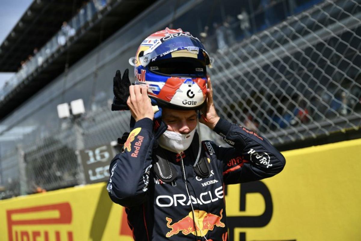 Red Bull Racing's Dutch driver Max Verstappen adjusts his helmet on the starting grid prior to the Italian Formula One Grand Prix at the Autodromo Nazionale Monza circuit, in Monza, northern Italy, on September 7, 2025.  Marco BERTORELLO / AFP