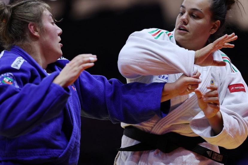 Italy's Asya Tavano (white) competes against Belgium's  Gabrielle Bouvier in the women's over 78 kg round of 16 at the World Judo Championships in Baku on October 10, 2026.  Anne-Christine POUJOULAT / AFP