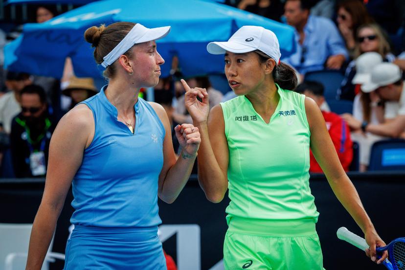 Belgian Elise Mertens (blue, L) and Chinese Zhang Shuai (green) pictured during during a first round match of Belgium-China's Mertens-Shuai pair against Romania-Russia's pair Cirstea-Kalinskya in the women doubles at the Australian Open, Melbourne Park, Melbourne on Wednesday 21 January 2026. Mertens - Shuai won the game. BELGA PHOTO PATRICK HAMILTON  --- BENELUX ONLY   ---