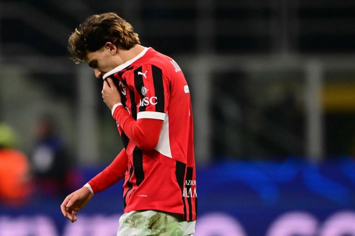 AC Milan's Portughese forward #79 Joao Félix reacts at the end of the UEFA Champions League knockout round play-off second leg football match between AC Milan and Feyenoord at San Siro stadium in Milan, on February 18, 2025.  Marco BERTORELLO / AFP
