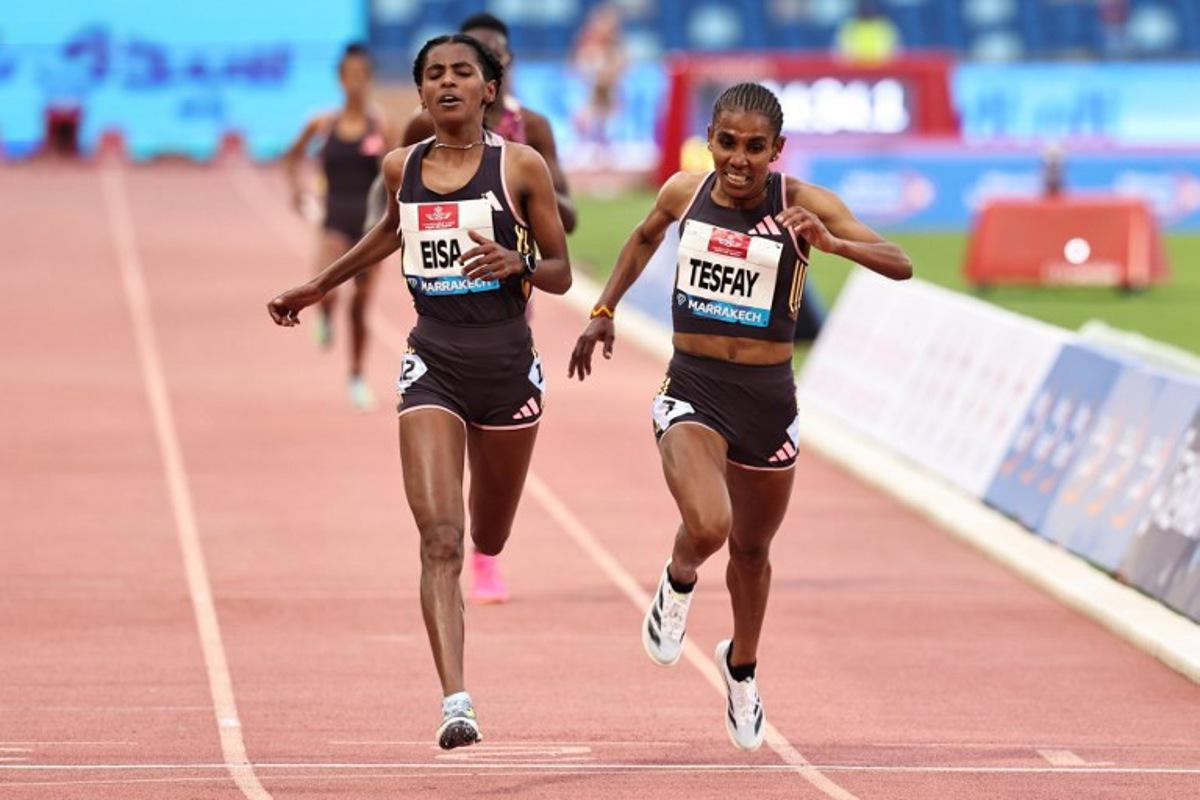 Ethiopia's Medina Eisa (L) and Fotyen Tesfay compete in the Women's 5000m during the IAAF Diamond League competition at the Grand Stadium in Marrakesh on May 19, 2024.  FADEL SENNA / AFP