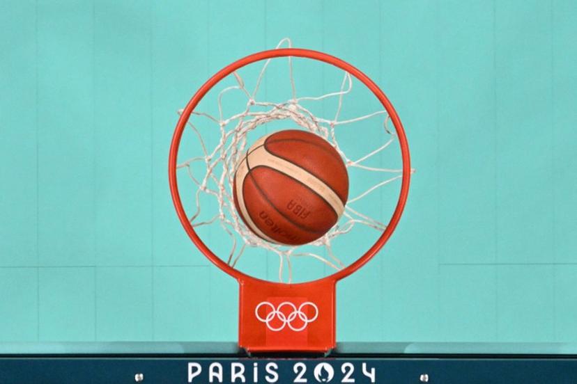 An overview shows the ball enter the basket in the women's preliminary round group A basketball match between Serbia and Puerto Rico during the Paris 2024 Olympic Games at the Pierre-Mauroy stadium in Villeneuve-d'Ascq, northern France, on July 28, 2024.  Sameer Al-DOUMY / POOL / AFP