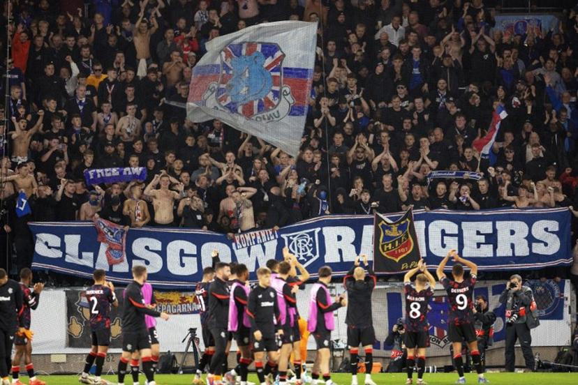 Rangers' players celebrate with supporters at the end of the UEFA Europa League football match between Malmoe FF and Rangers FC in Malmoe, Sweden on September 26, 2024. Rangers won the match 2-0. Andreas HILLERGREN / TT NEWS AGENCY / AFP