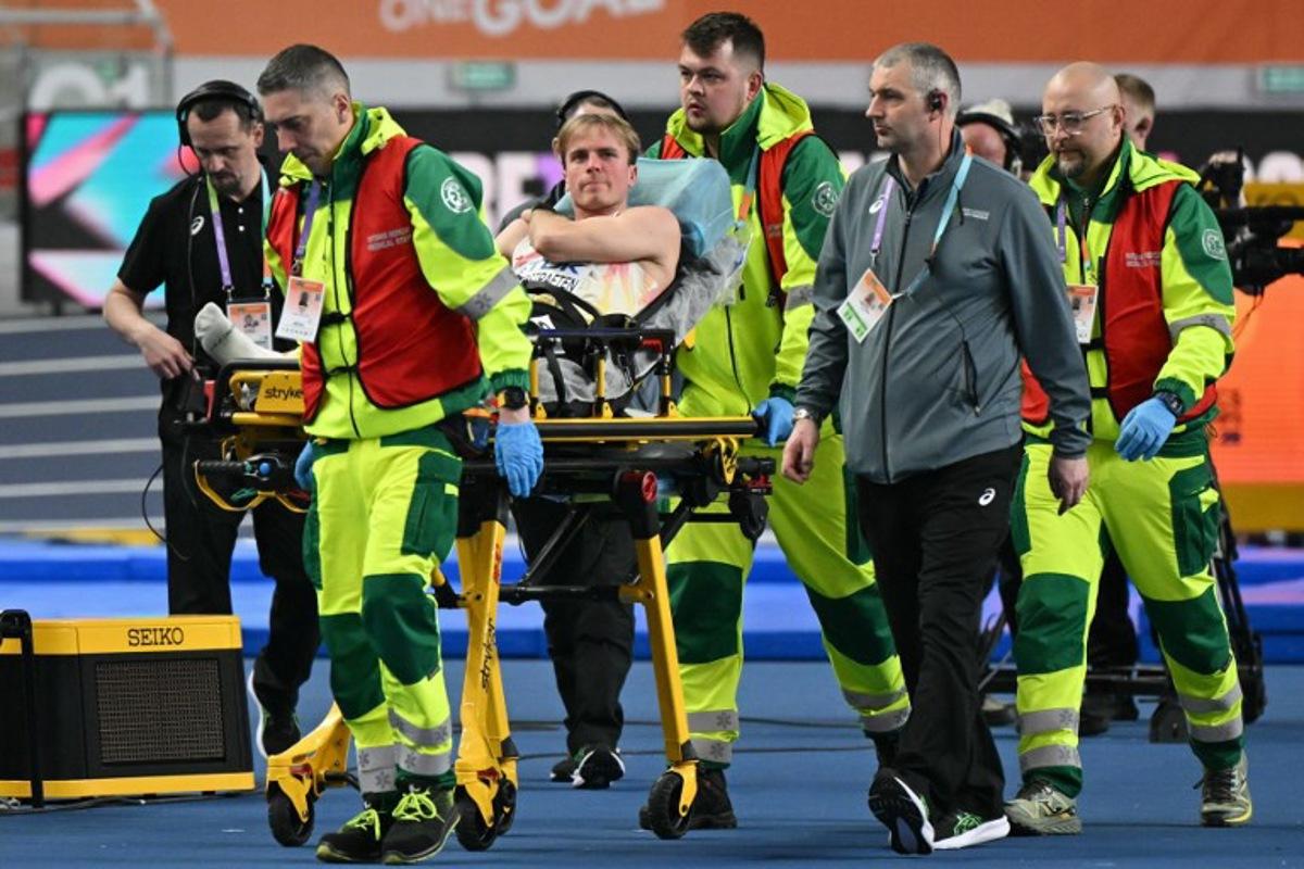 Belgium's Simon Verherstraeten is carried on a stretcher after the men's final 60 metres event during the World Athletics Indoor Championships Kujawy Pomorze 2026 in Torun, Poland on March 20, 2026.  Andrej ISAKOVIC / AFP