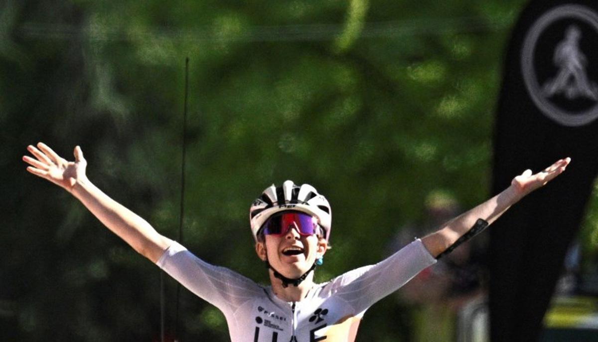 UAE Team ADQ's French rider Maeva Squiban celebrates as she crosses the finish line to win the 7th stage (out of 9) of the fourth edition of the Women's Tour de France cycling race, 159.7 km from Bourg-en-Bresse to Chambéry, in Chambéry, south-eastern France on August 1, 2025.  JULIEN DE ROSA / AFP