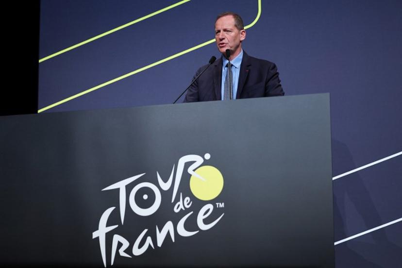 Tour de France General Director Christian Prudhomme addresses the audience during the presentation of the official routes of the 2026 edition of the men's and women's Tour de France cycling race in Paris on October 23, 2025.  Anne-Christine POUJOULAT / AFP
