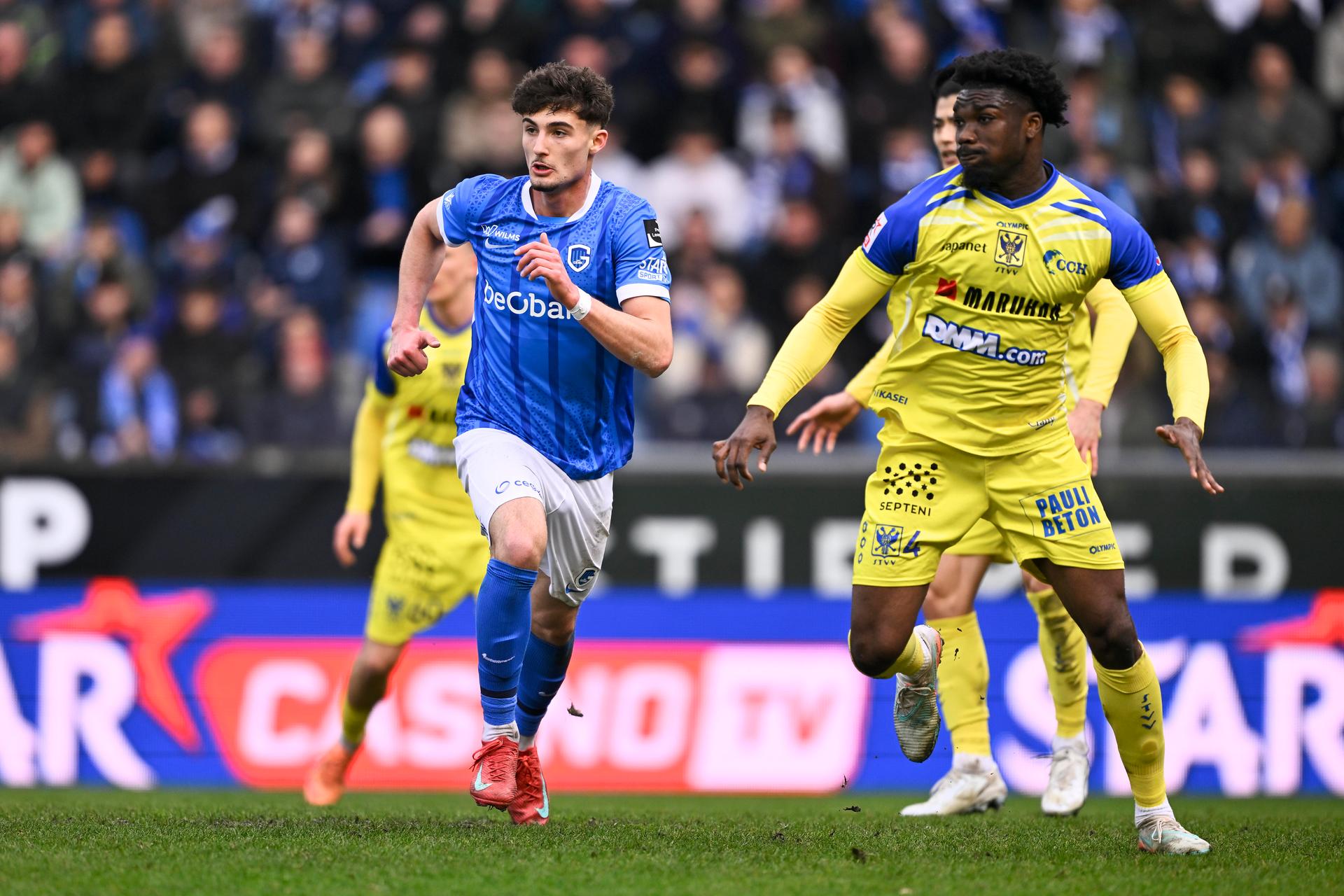 Genk's Robin Mirisola and STVV's Loic Mbe Soh pictured during a soccer match between KRC Genk and Sint-Truidense VV, Sunday 15 March 2026 in Genk, on day 29 of the 2025-2026 'Jupiler Pro League' first division of the Belgian championship. BELGA PHOTO JOHAN EYCKENS