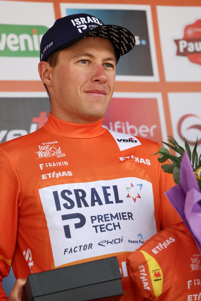 New Zealander Corbin John Strong of Israel-Premier Tech wearing the orange jersey of leader in the overall ranking after the fourth stage of the Tour De Wallonie cycling race, from Welkenraedt to Seraing (163,3 km), on Tuesday 29 July 2025. BELGA PHOTO BRUNO FAHY