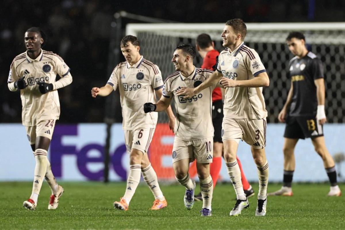 Ajax's Israeli midfielder #10 Oscar Gloukh celebrates after scoring the team's second goal during the UEFA Champions League league phase football match between Qarabag and Ajax at the Tofiq Bahramov Republican Stadium in Baku on December 10, 2025.  Giorgi ARJEVANIDZE / AFP