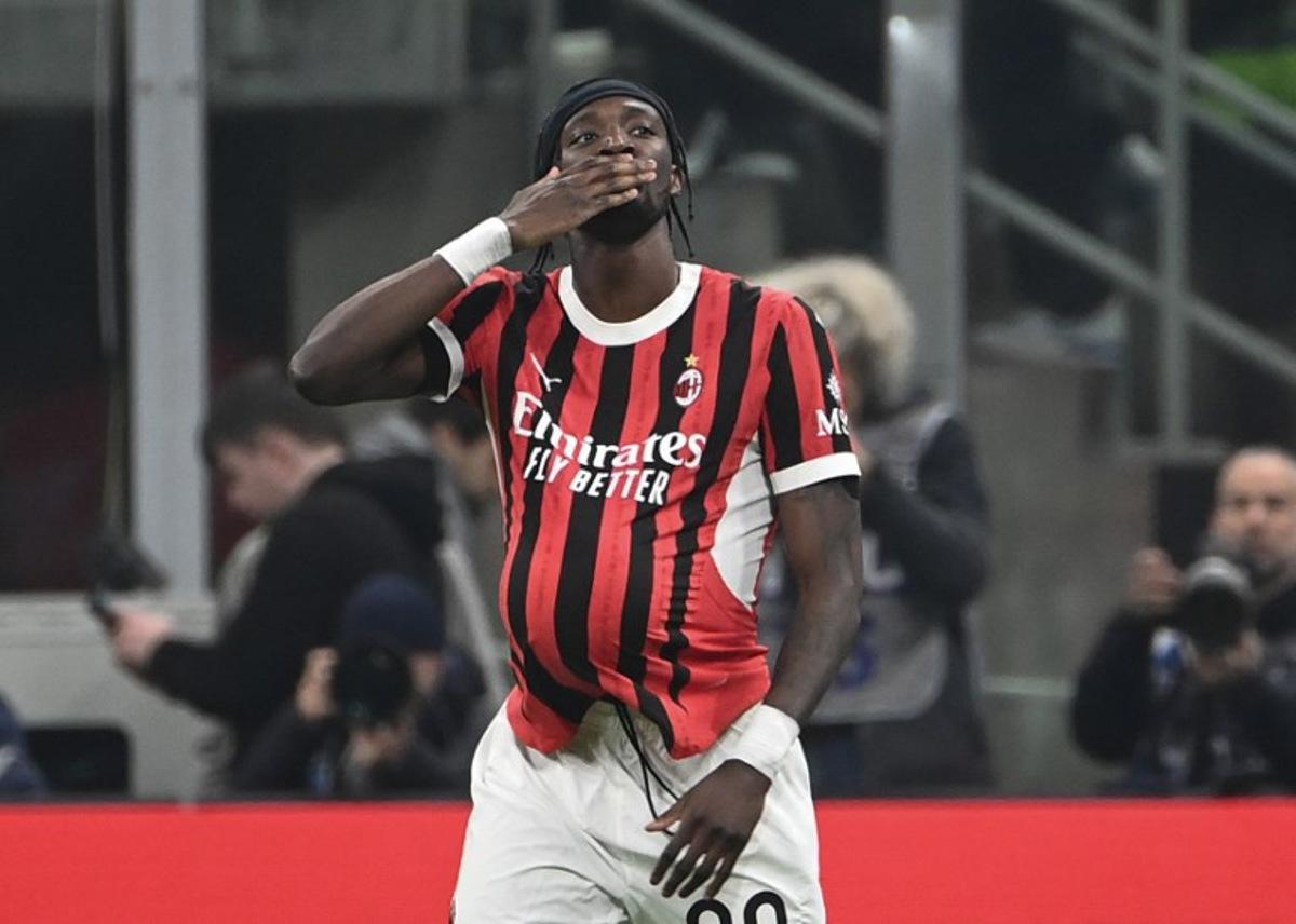 AC Milan's English forward #90 Tammy Abraham celebrates his team first goal during the Italian Cup semi-final first leg football match between AC Milan and Inter Milan at San Siro stadium in Milan, on April 2, 2025.  Isabella BONOTTO / AFP
