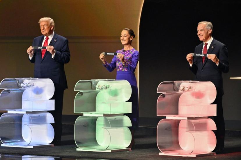 (L/R) US President Donald Trump holds the card reading USA, Mexico's President Claudia Sheinbaum holds the card reading Mexico and Canada's Prime Minister Mark Carney holds the card reading Canada during the draw for the 2026 FIFA Football World Cup taking place in the US, Canada and Mexico, at the Kennedy Center, in Washington, DC, on December 5, 2025.  Mandel NGAN / POOL / AFP