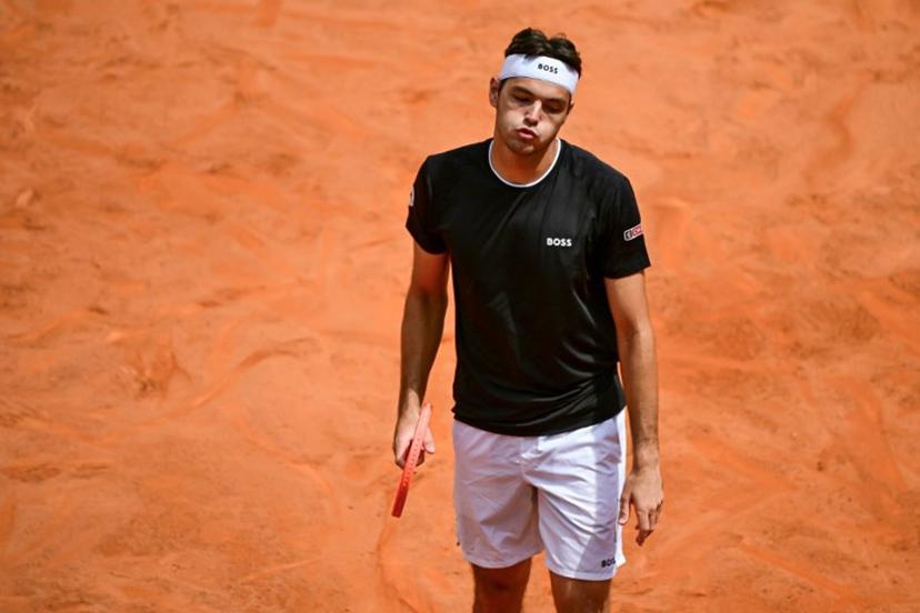 US' Taylor Fritz reacts during the men's singles match against US' Marcos Giron for the ATP Rome Open tennis tournament at Foro Italico in Rome on May 10, 2025.   PIERO CRUCIATTI / AFP