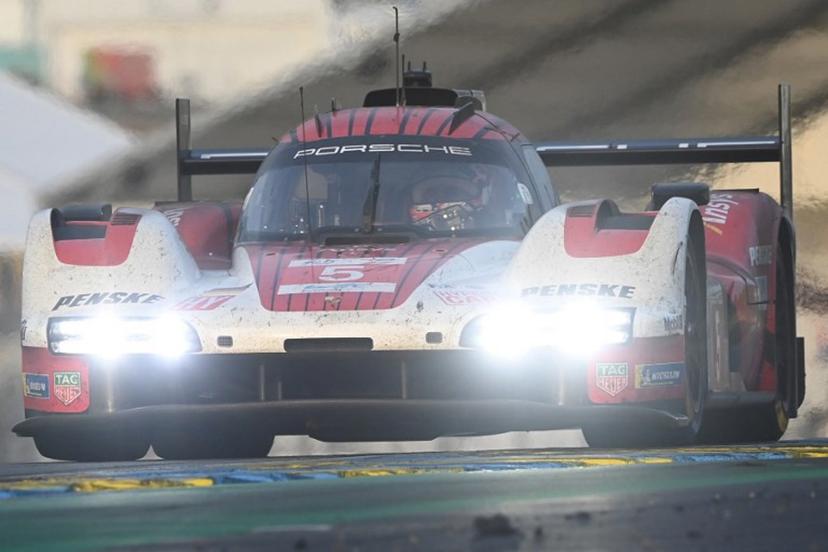 Porsche Penske Motorsport Thor Team's hypercar #06 Belgian driver Laurens Vanthoor competes during the 2025 Le Mans 24 hour endurance race, at the Le Mans circuit, in northwestern France, on June 15, 2025.  JEAN-FRANCOIS MONIER / AFP