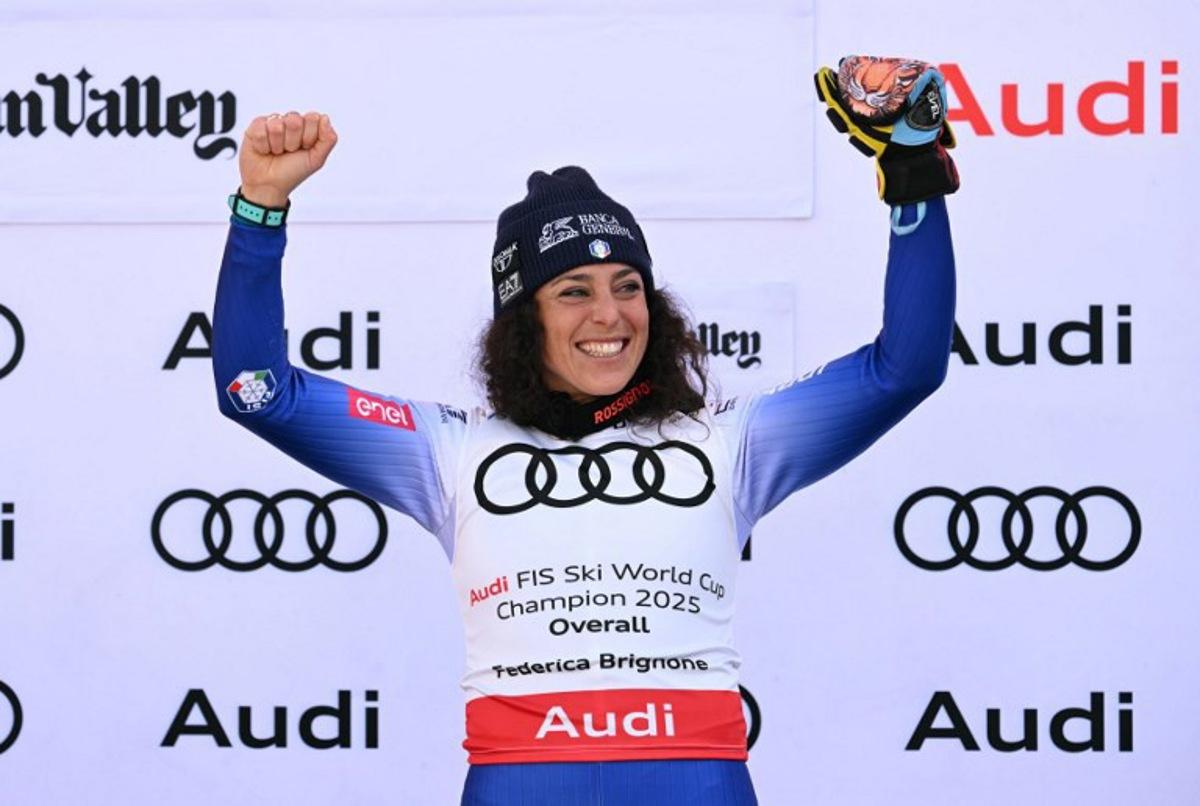 Women's overall winner Federica Brignone celebrates on the podium at the 2025 FIS Alpine World Cup Finals at Sun Valley Resort in Sun Valley, Idaho, on March 27, 2025.  Patrick T. Fallon / AFP
