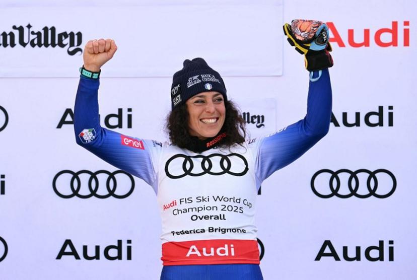 Women's overall winner Federica Brignone celebrates on the podium at the 2025 FIS Alpine World Cup Finals at Sun Valley Resort in Sun Valley, Idaho, on March 27, 2025.  Patrick T. Fallon / AFP