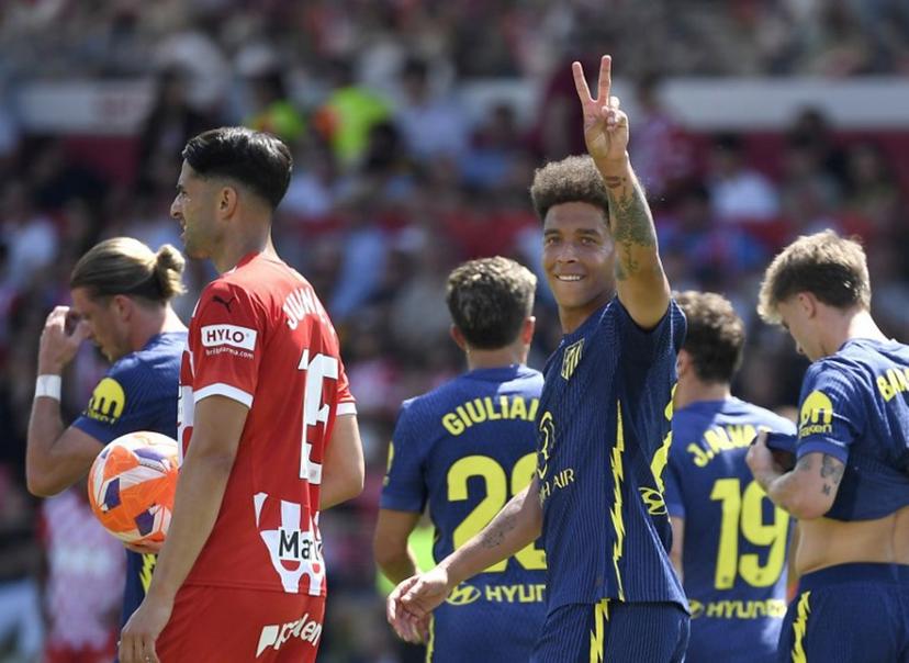 Atletico Madrid's Belgian midfielder #20 Axel Witsel celebrates after Atletico Madrid's second goal during the Spanish league football match between Girona FC and Club Athletic de Madrid at Montilivi Stadium in Girona, on May 25, 2025.  Josep LAGO / AFP
