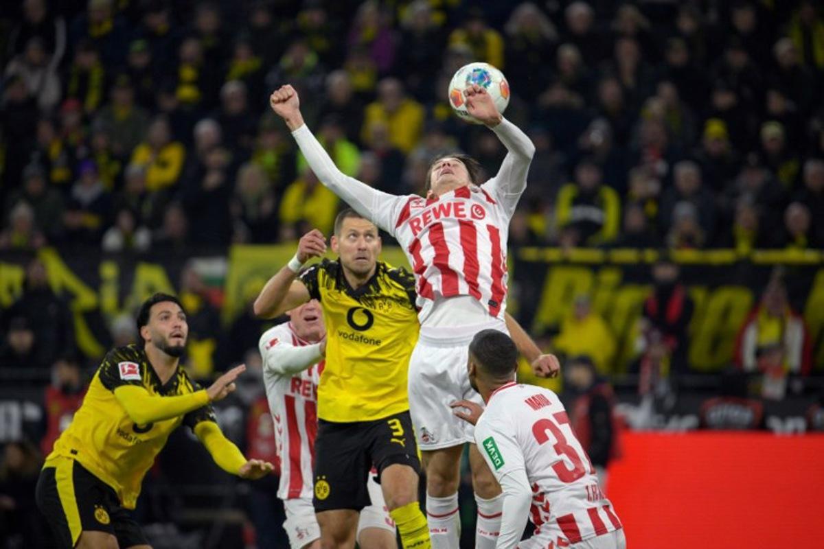 Dortmund's German defender #03 Waldemar Anton and FC Cologne's Belgian-Spanish midfielder #17 Alessio Castro-Montes vie for the ball during the German first division Bundesliga football match between BVB Borussia Dortmund and 1 FC Cologne in Dortmund, Germany on October 25, 2025.  Sascha Schuermann / AFP