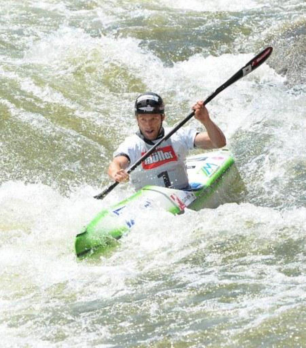 Slovenian Nejc Znidarcic competes in the Kayak K1 men race at the ICF Wildwater Canoeing Sprint World in the southern German city of  Augsburg, on June 12, 2011. AFP PHOTO/CHRISTOF STACHE