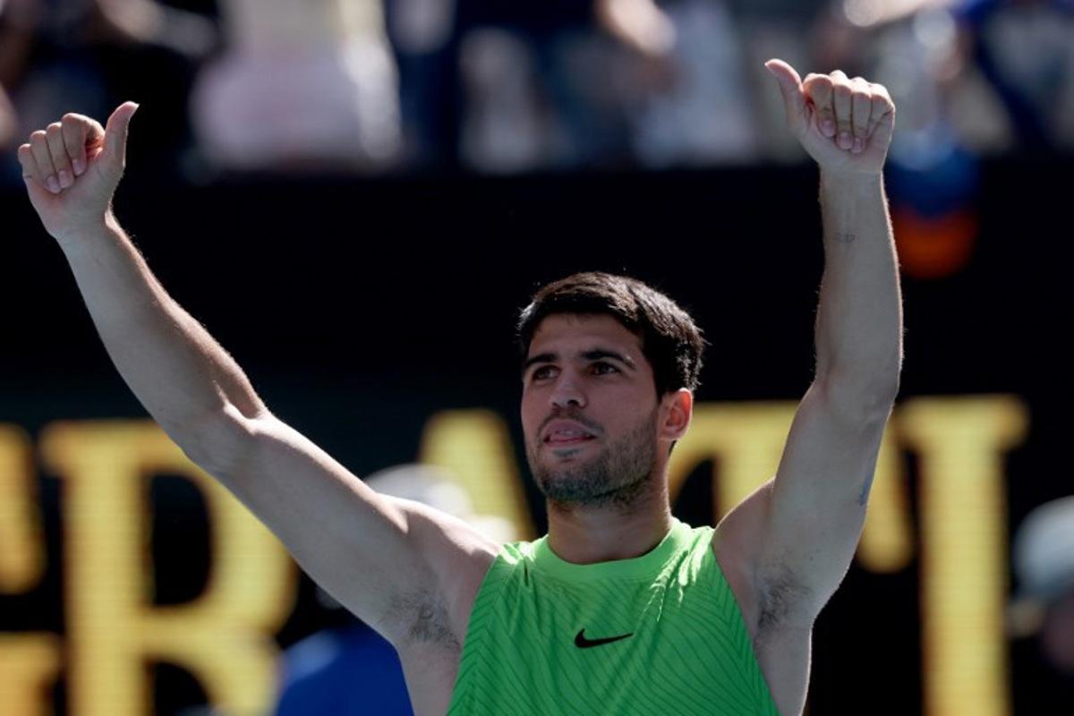 Spain's Carlos Alcaraz celebrates victory over USA's Tommy Paul after their men's singles match on day eight of the Australian Open tennis tournament in Melbourne on January 25, 2026.   DAVID GRAY / AFP