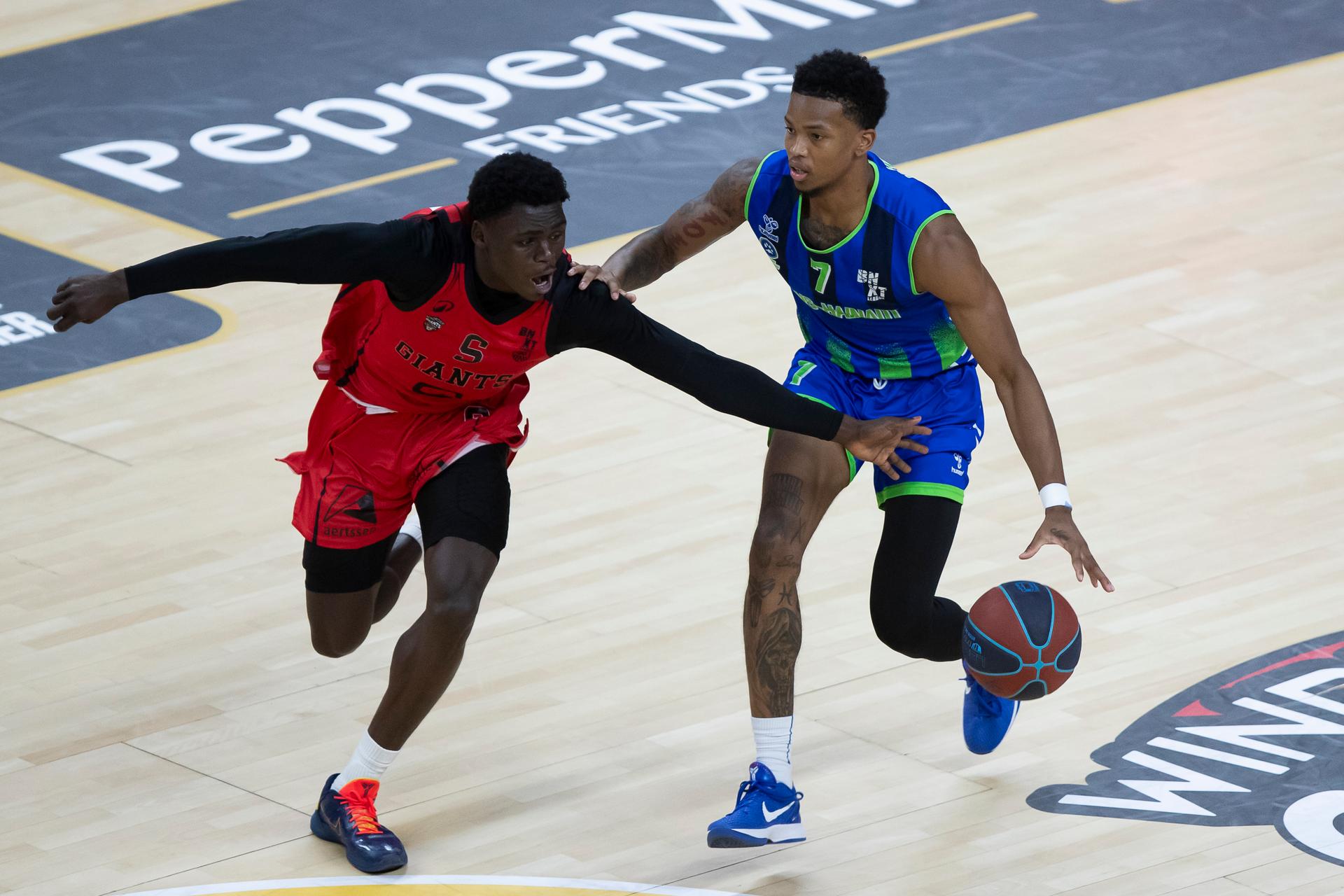 Antwerp's Enoch Cheeks and Mons' Malik Whitaker pictured during a basketball match between Antwerp Giants and Mons-Hainaut, Sunday 26 October 2025 in Antwerp, matchday 5/34 in the 'BNXT League' Belgian/ Dutch first division basket championship. BELGA PHOTO KRISTOF VAN ACCOM