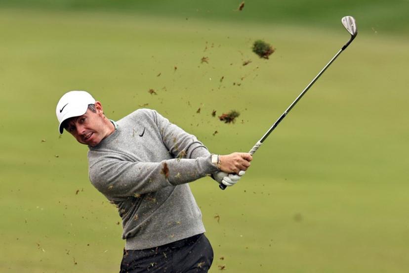 Rory McIlroy of Northern Ireland plays a shot on the 1st hole during the Hero Dubai Desert Classic golf tournament at the Emirates Golf Club in Dubai on January 25, 2026. Fadel SENNA / AFP