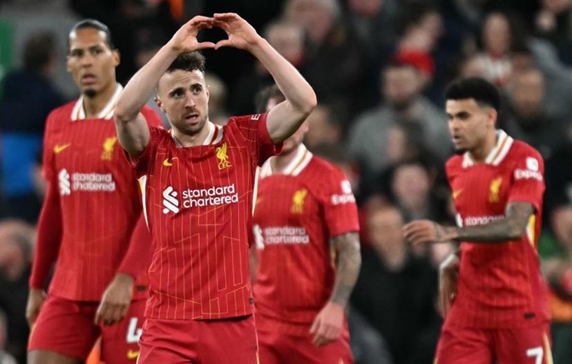 Liverpool's Portuguese striker #20 Diogo Jota (2L) celebrates scoring the opening goal during the English Premier League football match between Liverpool and Everton at Anfield in Liverpool, north west England on April 2, 2025.  Paul ELLIS / AFP