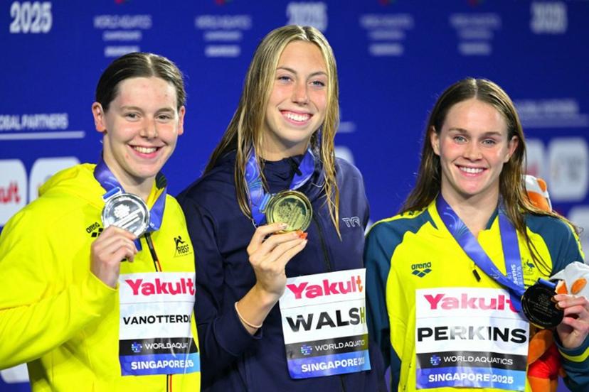 Gold medallist  US' swimmer Gretchen Walsh (C), silver medallist Belgium's swimmer Roos Vanotterdijk (L) and bronze medallist Australia's swimmer Alexandria Perkins (R) pose on the podium of the women's 100m butterfly swimming event during the 2025 World Aquatics Championships in Singapore on July 28, 2025.  François-Xavier MARIT / AFP