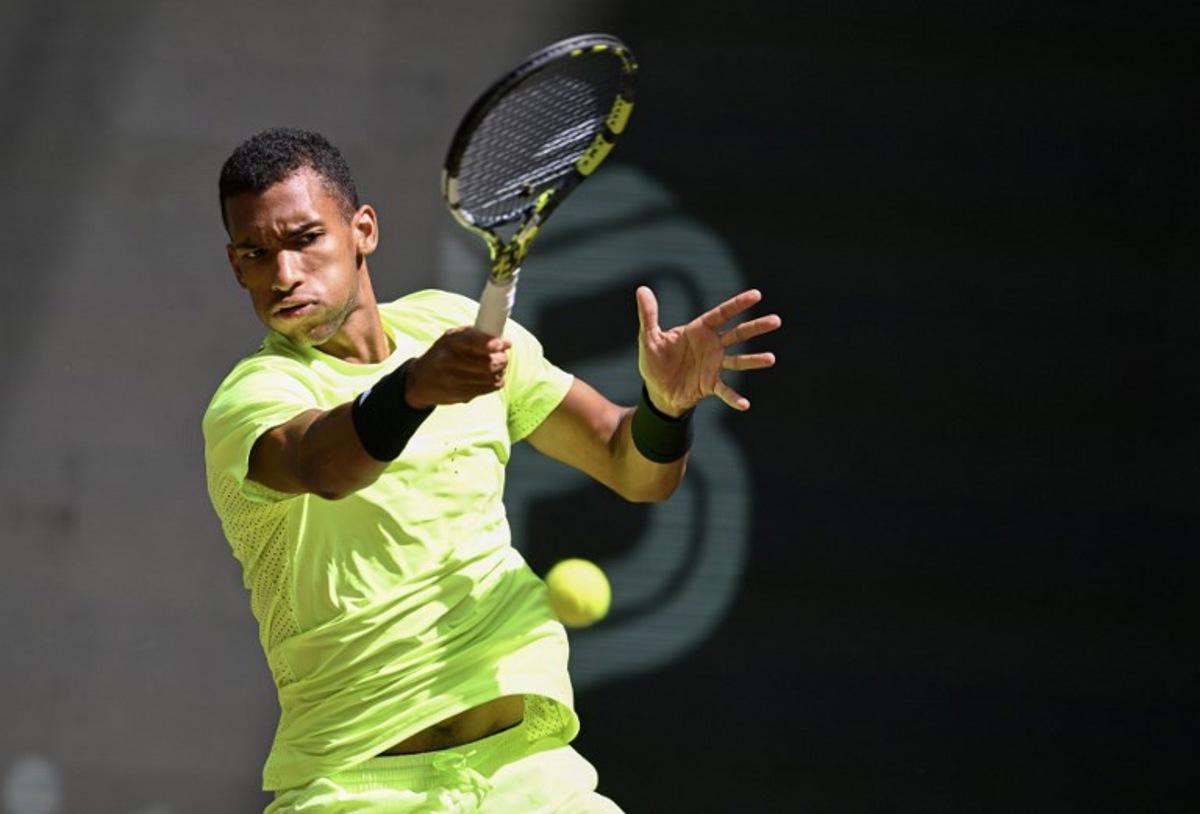 Canada's Felix Auger-Aliassime returns a ball to Russia's Karen Khachanov (not in picture) during their match at the ATP tennis tournament in Halle (Westfalen), western Germany, on June 19, 2025.  CARMEN JASPERSEN / AFP
