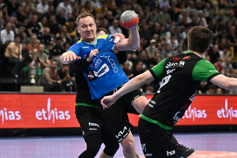 Bocholt's Rafal Przybylski fights for the ball during a handball game between Hubo handbal Hasselt and Achilles Bocholt, Saturday 19 April 2025, in Hasselt, the men's final of the Belgian handball cup. BELGA PHOTO JOHAN EYCKENS