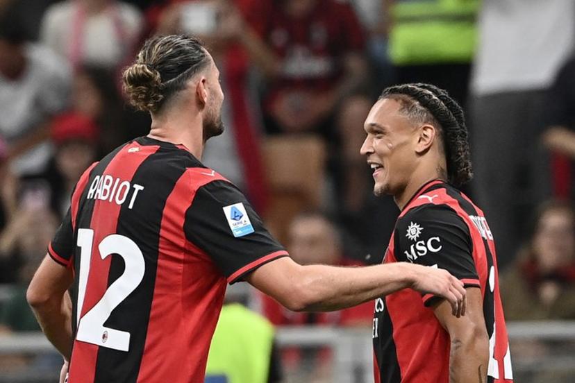 Milan's Belgian midfielder #22 Diego Moreira (R) celebrates with Milan's French midfielder #12 Adrien Rabiot (C) after scoring his team's third goal during the Italian Serie A football match between AC Milan and Lecce at the San Siro stadium in Milan, on September 20, 2026.  Isabella BONOTTO / AFP