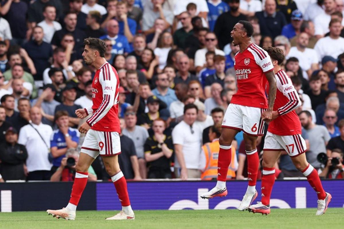 Arsenal's German midfielder #29 Kai Havertz (L) scores the team's first goal during the English Premier League football match between Arsenal and Chelsea at the Emirates Stadium in London on September 6, 2026.   Adrian Dennis / AFP
