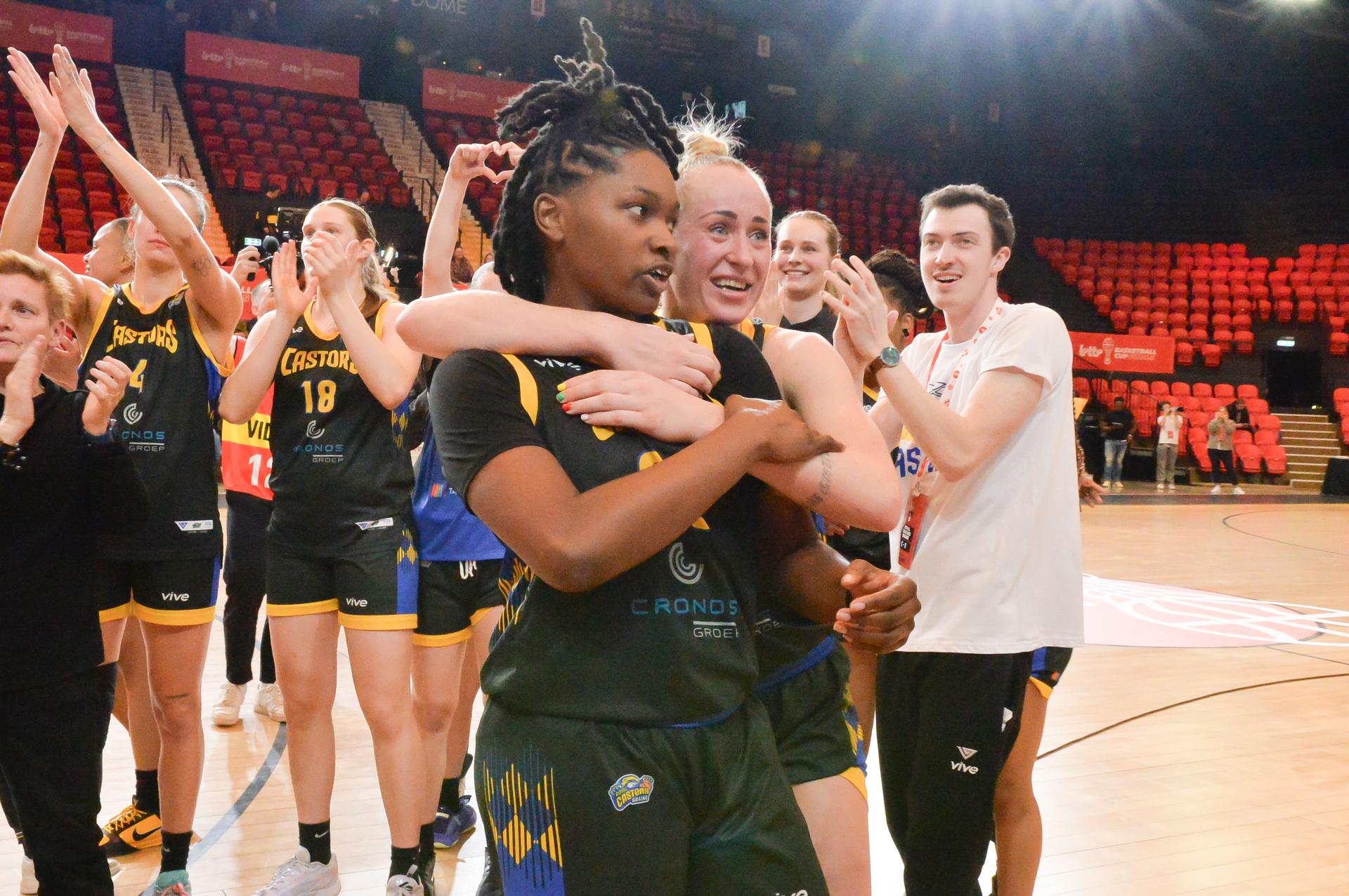 Castors' Juliunn Redmond and Castors' Santa Okockyte celebrate after winning a basketball match between Kangoeroes Mechelen and Castors Braine, Saturday 08 March 2025 in Oostende, the final of the women's Belgian Basketball Cup. BELGA PHOTO JILL DELSAUX