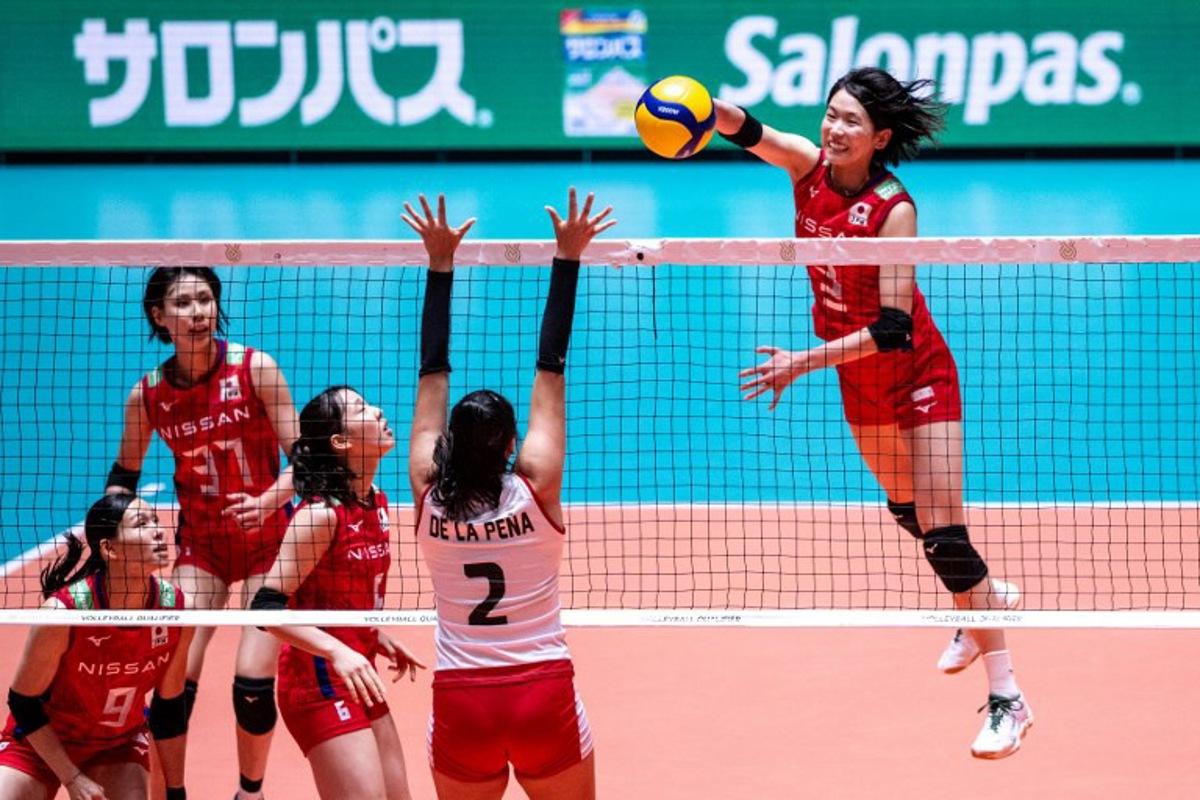 Japan's Sarina Koga (R) spikes the ball during the Volleyball World Cup 2023 Women's match between Japan and Peru at Yoyogi National Stadium in Tokyo on September 16, 2023.  Philip FONG / AFP