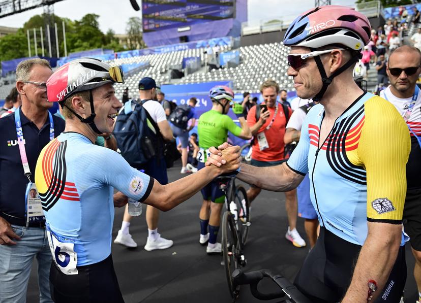 Belgian cyclist Remco Evenepoel and Belgian cyclist Wout van Aert celebrate after the men's road race at the Paris 2024 Olympic Games, on Saturday 03 August 2024 in Paris, France. The Games of the XXXIII Olympiad are taking place in Paris from 26 July to 11 August. The Belgian delegation counts 165 athletes competing in 21 sports. BELGA PHOTO DIRK WAEM