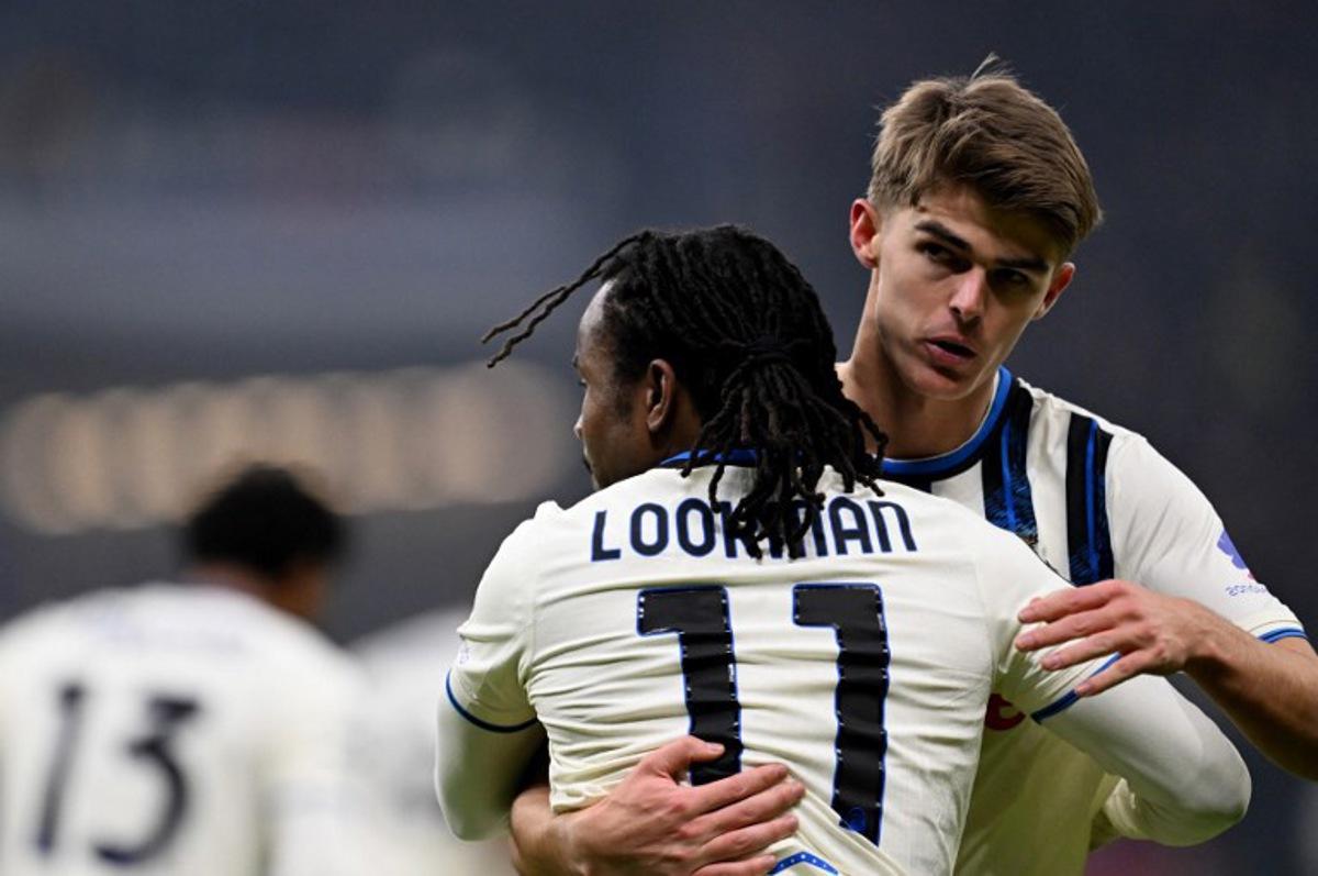 Atalanta's Nigerian forward #11 Ademola Lookman (front) celebrates scoring his team's first goal with Atalanta's Belgian forward #17 Charles De Ketelaere during the UEFA Champions League league phase day 5 football match between Eintracht Frankfurt and Atalanta Bergamo in Frankfurt, Germany, on November 26, 2025.  Kirill KUDRYAVTSEV / AFP