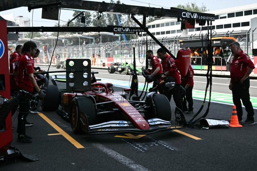 Ferrari's Monegasque driver Charles Leclerc stops in the pits during the first practice session of the Mexico City Formula One Grand Prix at the Hermanos Rodriguez racetrack in Mexico City on October 24, 2025.  Carl DE SOUZA / AFP