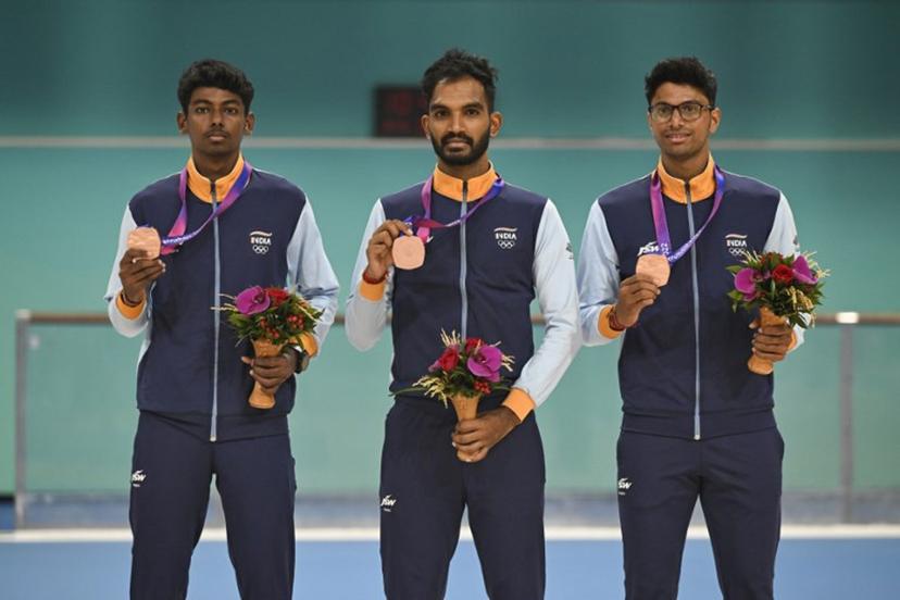 Bronze medallists India's Vikram Rajendra Ingale, Anandkumar Velkumar and Siddhant Rahul Kamble attend the awards ceremony of the men's 3000m relay speed skating event during the 2022 Asian Games in Hangzhou in China's eastern Zhejiang province on Octorber 2, 2023.  WANG Zhao / AFP