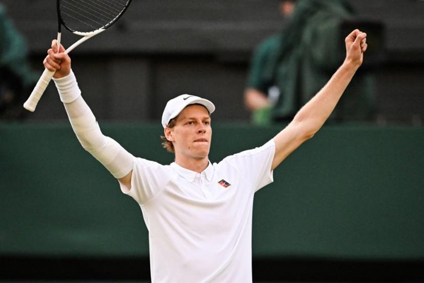 Italy's Jannik Sinner celebrates after victory against Spain's Carlos Alcaraz at the end of their men's singles final tennis match on the fourteenth day of the 2025 Wimbledon Championships at The All England Lawn Tennis and Croquet Club in Wimbledon, southwest London, on July 13, 2025.  Kirill KUDRYAVTSEV / AFP