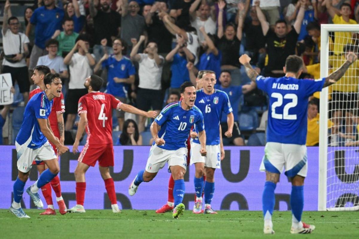 Italy's forward #10 Giacomo Raspadori (C) celebrates scoring his team's first goal during the 2026 World Cup qualifiers Europe zone group I football match between Italy and Moldova at the Mapei Stadium in Reggio Emilia, on June 9, 2025.  Alberto PIZZOLI / AFP
