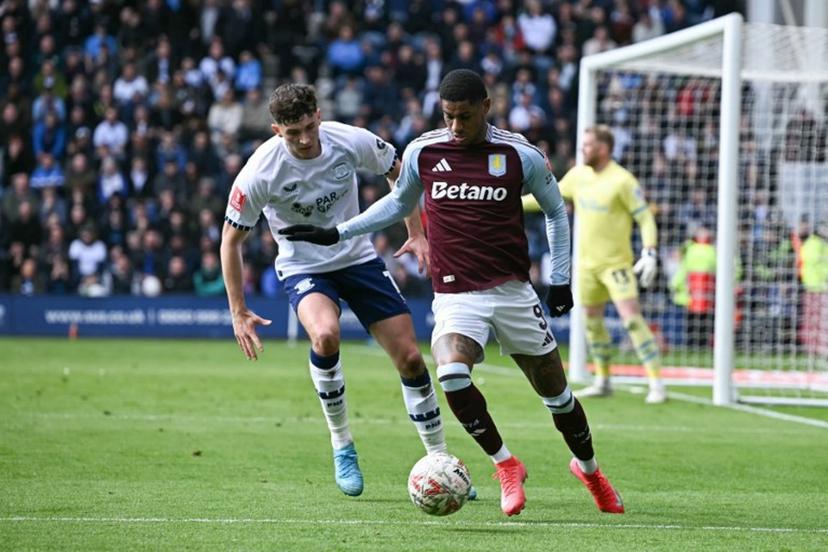 Preston's Irish striker #07 Will Keane (L) fights for the ball with Aston Villa's English striker #09 Marcus Rashford (R) during the English FA Cup quarter-final football match between Preston North End and Aston Villa at Deepdale stadium in Preston, north-west England on March 30, 2025.  Paul ELLIS / AFP