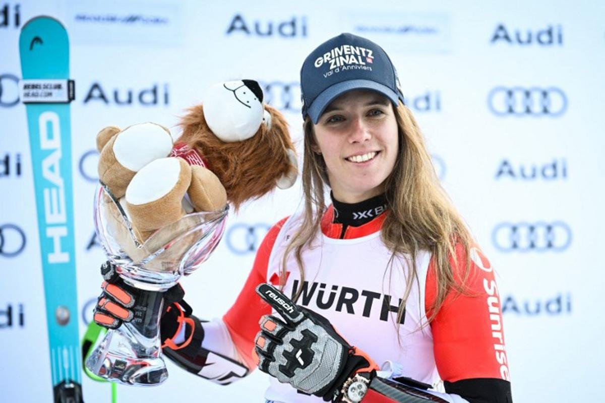 First-placed Switzerland's Camille Rast celebrates with her trophy on the podium after competing in the Women's Giant Slalom, part of the FIS Alpine Ski World Cup 2025-2026, in Kranjska Gora, Slovenia, on January 3, 2026.  Jure Makovec / AFP