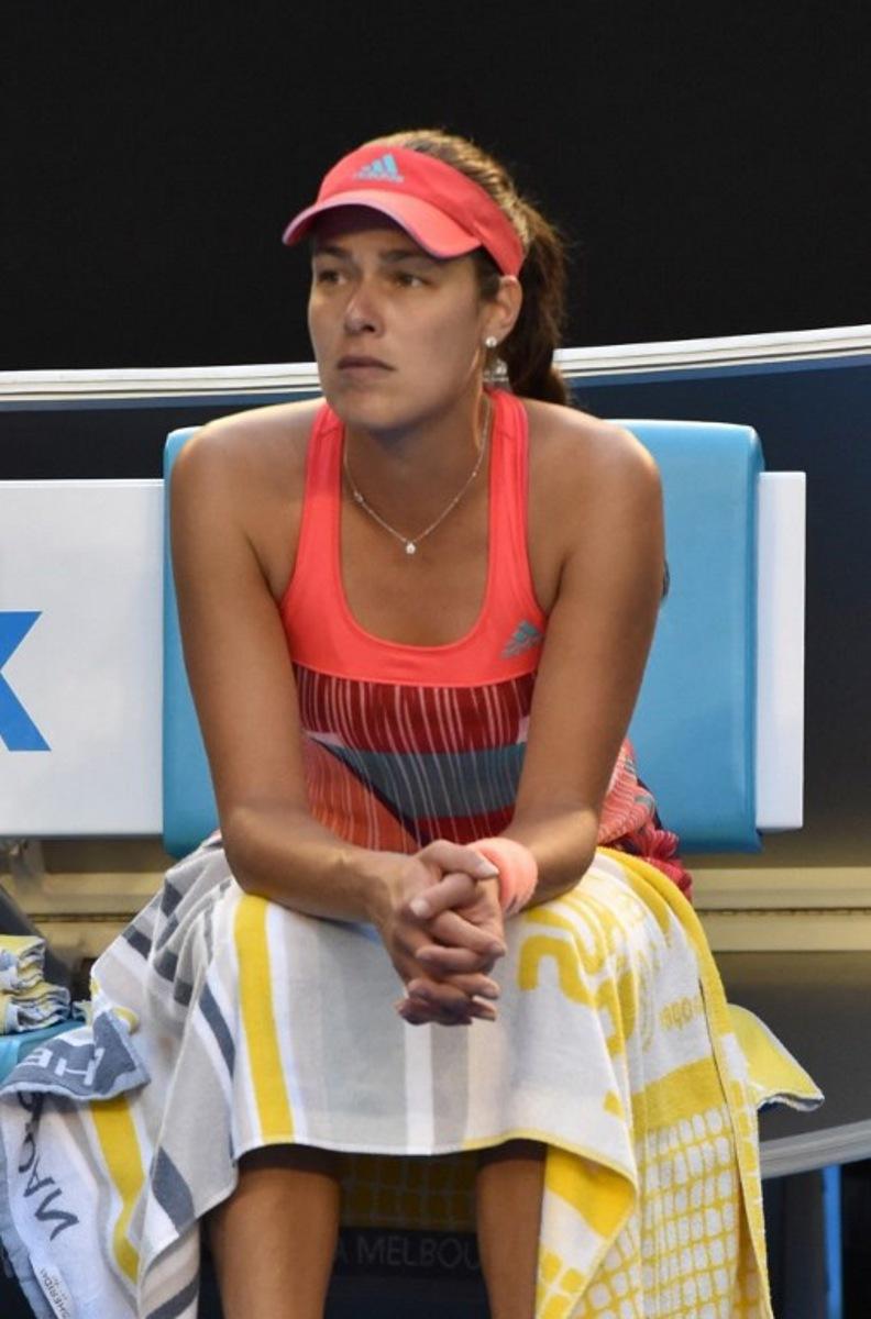 Serbia's Ana Ivanovic looks on after her match against Madison Keys of the US was suspended following a medical emergency with Ivanovic's coach Nigel Sears on day six of the 2015 Australian Open tennis tournament in Melbourne on January 23, 2016. AFP PHOTO / SAEED KHAN-- IMAGE RESTRICTED TO EDITORIAL USE - STRICTLY NO COMMERCIAL USE  SAEED KHAN / AFP