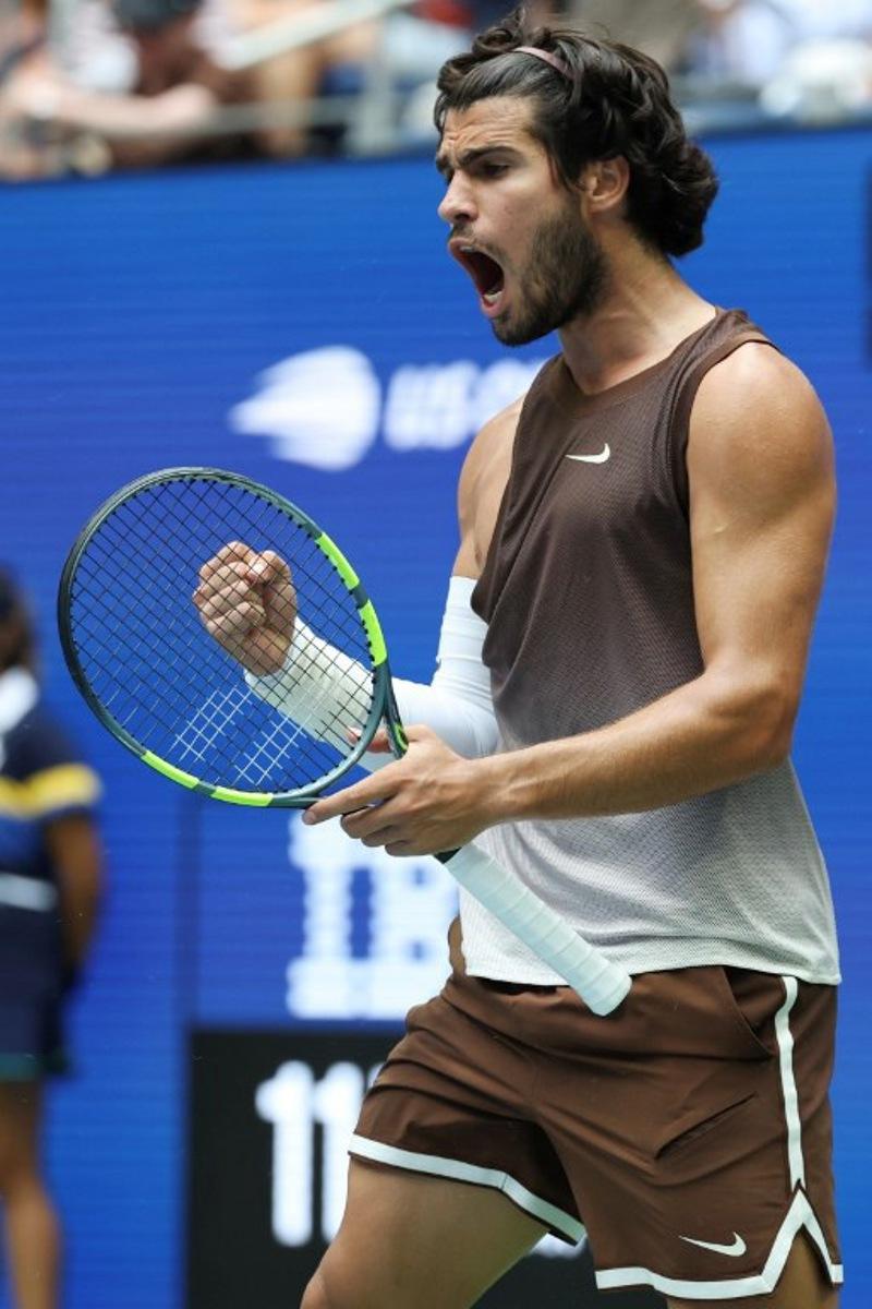 Spain's Carlos Alcaraz reacts after a point as he plays Russia's Roman Safiullin in their men's singles first round tennis match on day two of the US Open tennis tournament at the USTA Billie Jean King National Tennis Center in New York City on August 31, 2026.  TIMOTHY A. CLARY / AFP