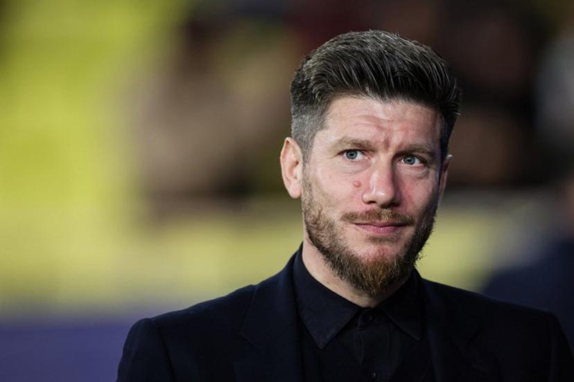 Monaco's Belgian head coach Sebastien Pocognoli reacts as he arrives on the pitch prior to the UEFA Champions League, league phase, football match between Monaco and Galatasaray, at the Stade Louis II stadium, in Monaco, on December 9, 2025.  Valery HACHE / AFP