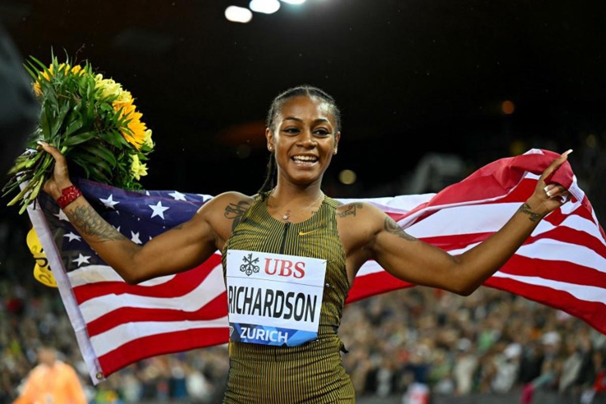 US' Sha'Carri Richardson celebrates after winning the Women's 100m final during the Diamond League athletics meeting at the Letzigrund stadium in Zurich on September 5, 2024.  Fabrice COFFRINI / AFP