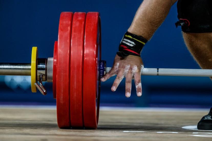 Estonia's Mart Seim competes in the men's +102kg weightlifting event during the Paris 2024 Olympic Games at the South Paris Arena in Paris, on August 10, 2024.   JEFF PACHOUD / AFP